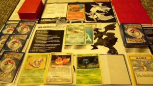 Well-organized trading card collection displayed in protective binders and sleeves.